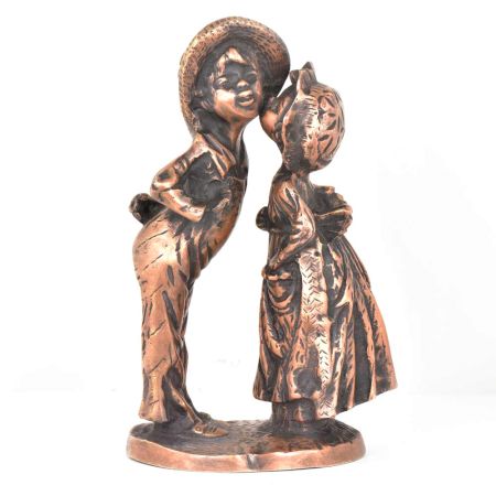 Figurines of a Girl  kissing a Boy