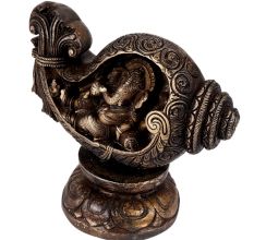 Brass Ganesha Sitting in a Conch In Black Finish