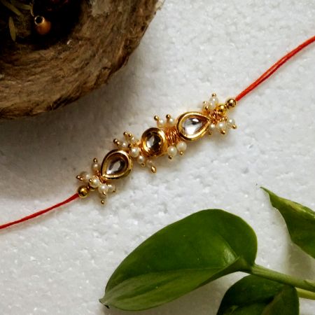 Traditional Rakhi with Kundan Beads, Acrylic, Metal, Wooden