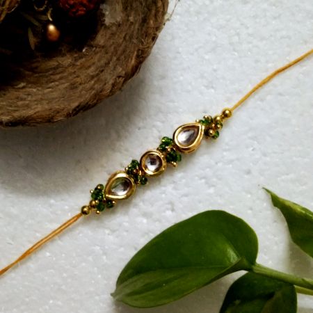 Traditional Rakhi with Metal, Kundan Beads, Acrylic, Wooden