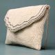 Ivory Elegance Scalloped Beaded Clutch with Gold Chain Strap